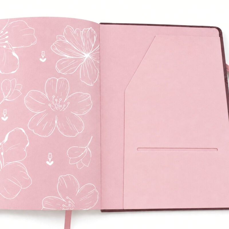 agenda de piel Planifesting 2027, guarda rosa con flores line art y porta hojas interior, listón rosa