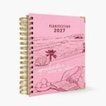 agenda de pasta dura Planifesting 2027 rosa "aprendiendo a vivir en calma" de tres cuartos con esquineros dorados