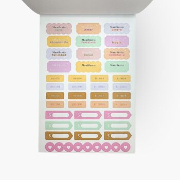 Hojas de stickers del libro Me quiero un chingo con frases de manifestación como éxito, amor, salud, abundancia y recordatorios de reuniones y hábitos.